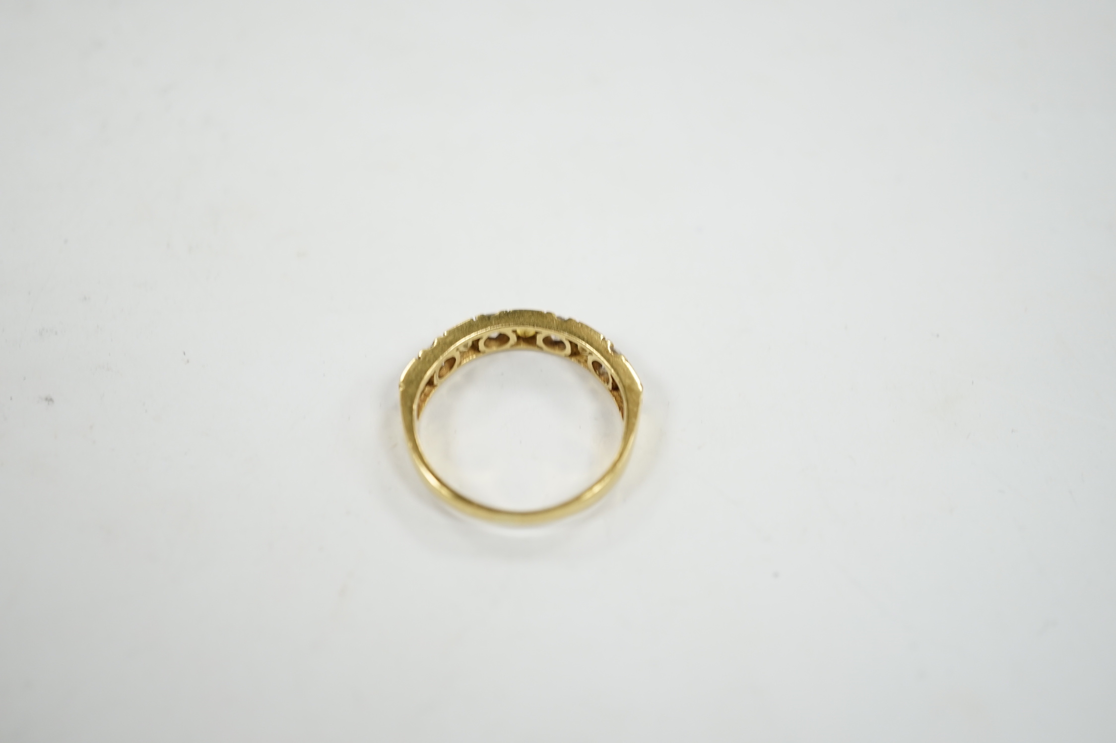 A yellow metal, five stone square cut yellow sapphire and four stone round cut diamond set half hoop ring, size N, gross weight 3.2 grams.
